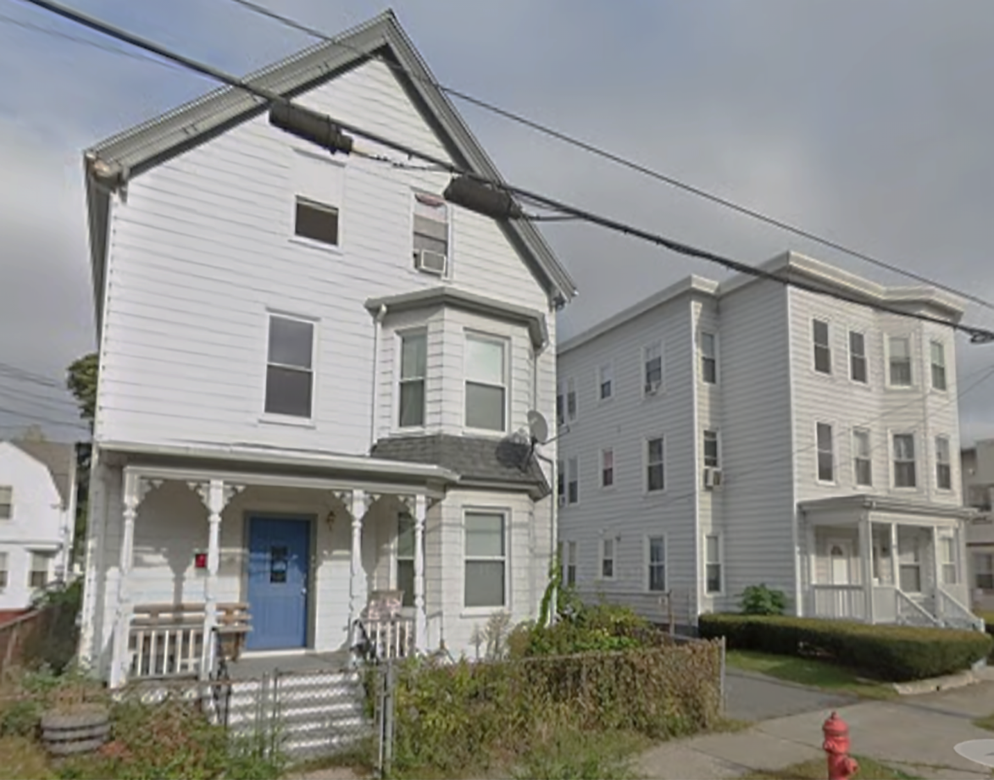 Three-story, wood-frame residential buildings